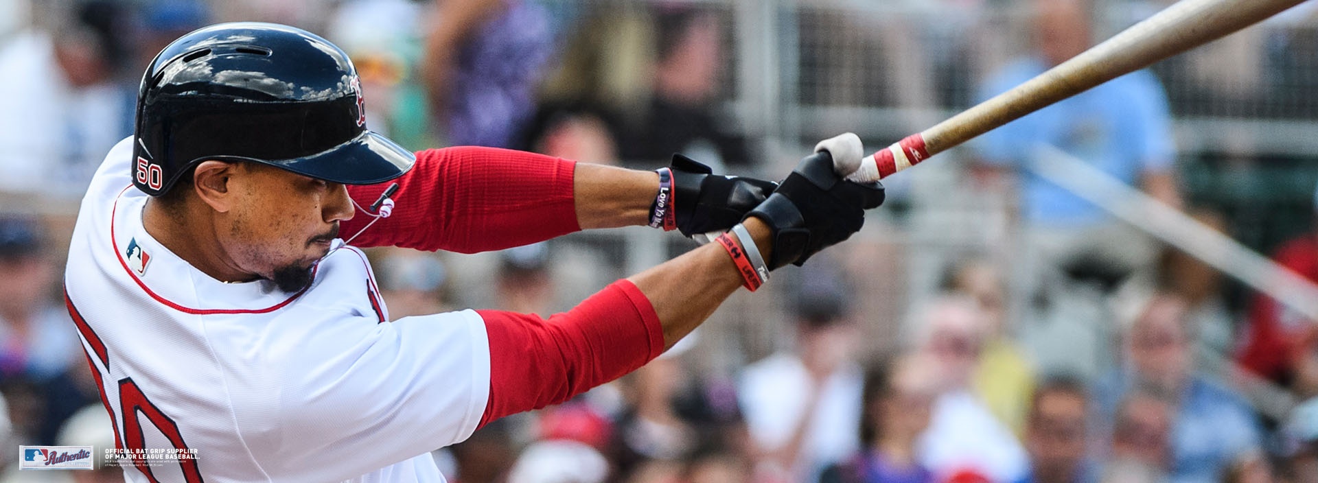 MLB player swinging a bat